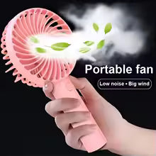 Rechargeable mini portable fan in pink with handheld design blowing air and leaves