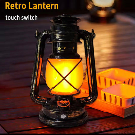 Retro portable lantern rechargeable with touch switch emitting warm yellow light on wooden surface