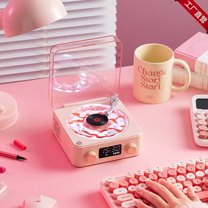 Clarify.pk retro turntable Bluetooth speaker with a pink and white design on a pink desk setup
