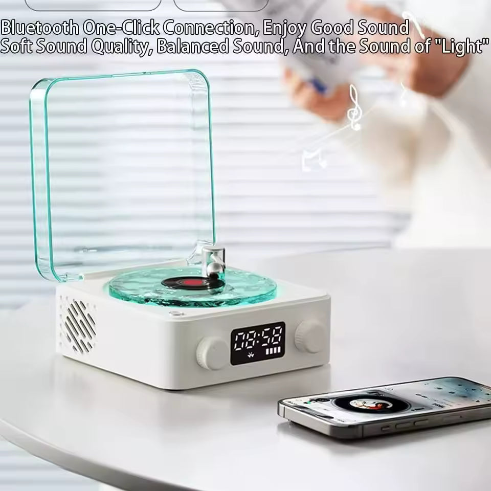 Clarify.pk retro turntable Bluetooth speaker with clear lid and digital display playing music from smartphone
