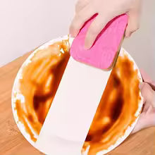 Bright pink reusable dishcloths for kitchen wiping off sauce from a white plate