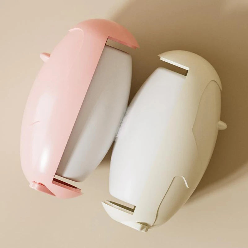 Pink and white reusable lint remover with ergonomic design for easy fabric cleaning