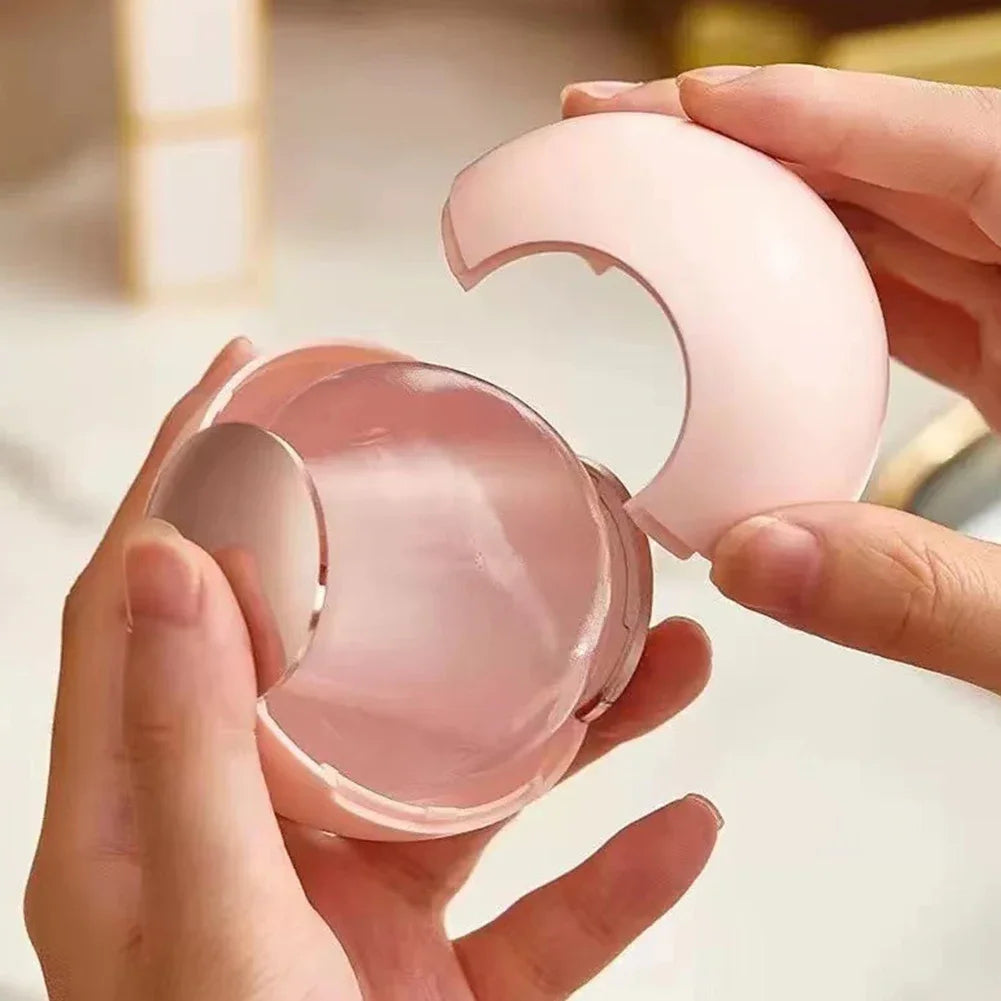 Hands holding and opening a pink reusable lint roller ball for easy cleaning and pet hair removal