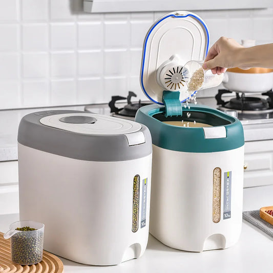 Rice storage container with airtight lid in white and green, showing rice being poured inside in modern kitchen