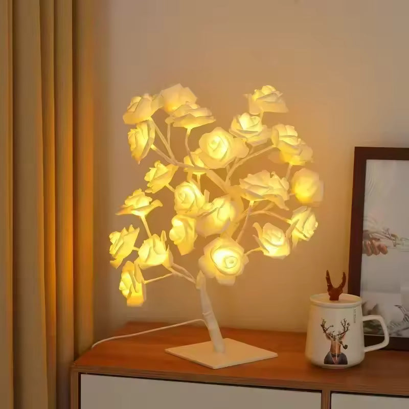 Rose LED lamp for home decor by Clarify.pk glowing softly on a wooden table at night