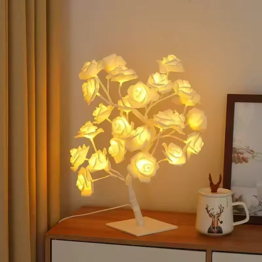 Rose LED lamp for home decor by Clarify.pk glowing softly on a wooden table at night