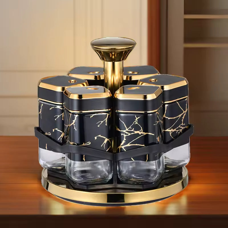 Clarify.pk rotating spice jar set with black and gold marble design jars on gold and black stand