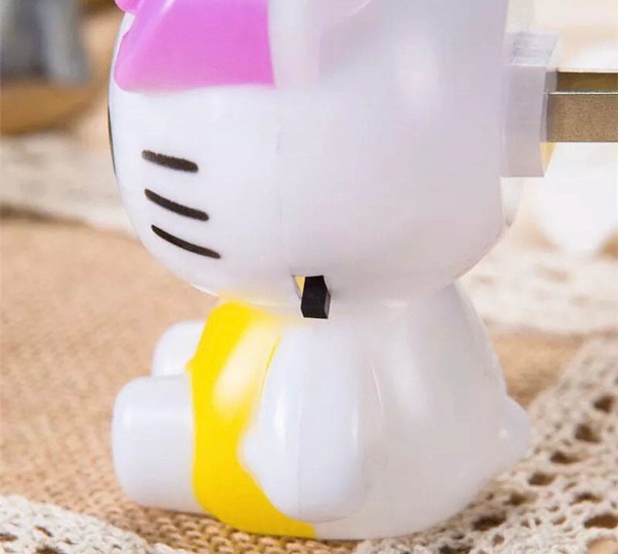 Hello Kitty night light plug-in with yellow outfit and pink bow for kids bedroom