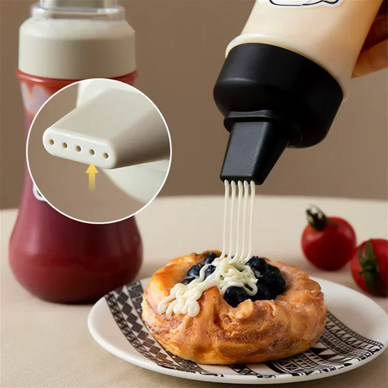 Clarify.pk 350ml sauce squeeze bottle dispensing sauce on pastry with close-up nozzle view