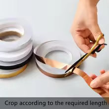 Hand cutting self adhesive tile stickers tape from multiple rolls for DIY home decoration