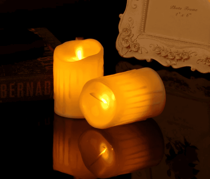 Set of 12 flameless tea lights glowing with warm yellow light for safe indoor decoration