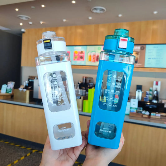 Clarify.pk 900ml leak proof water bottle in white and blue with measurement markings and secure caps