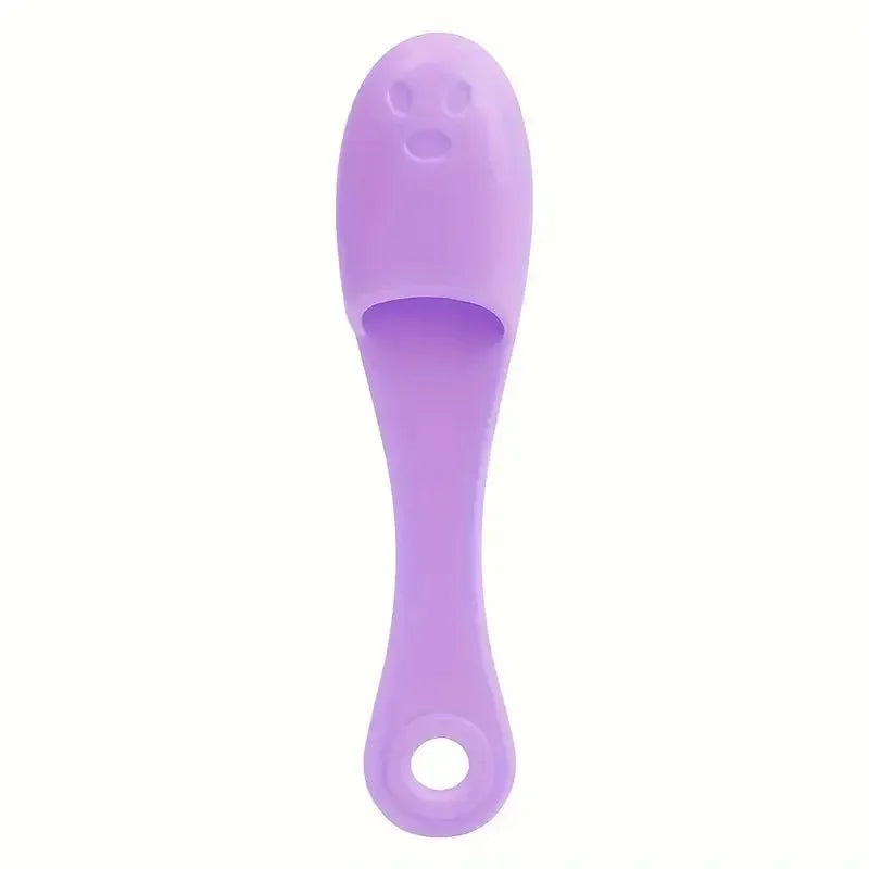Purple silicone facial brush cleaner with ergonomic handle and face design for easy cleaning