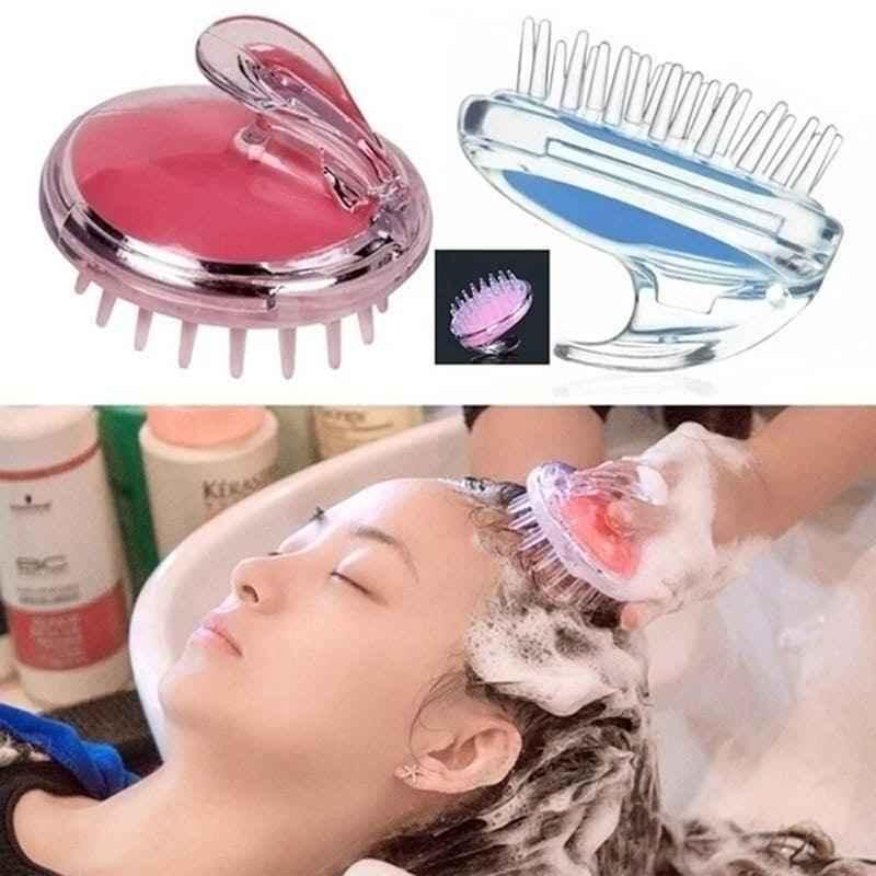 Clarify.pk silicone scalp massage brush in pink and clear used during shampoo for a relaxing scalp massage
