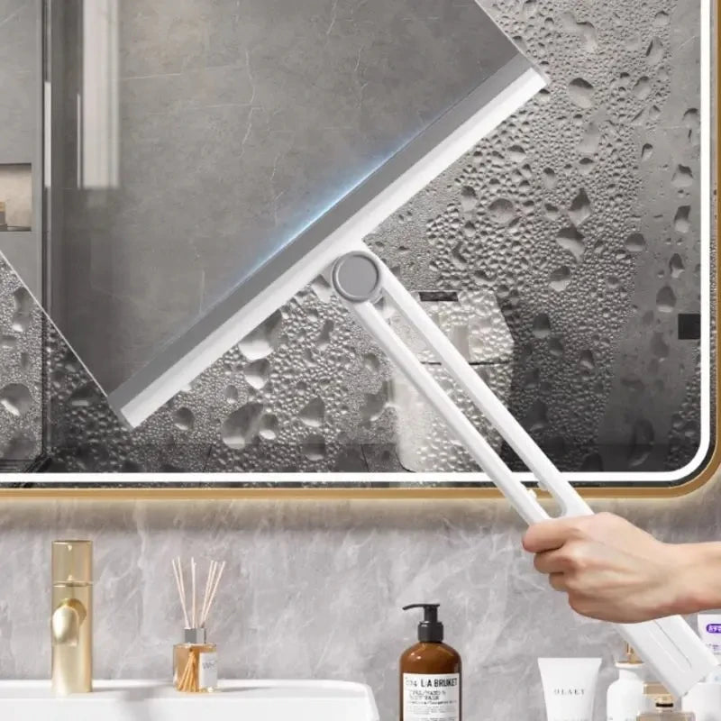 Clarify.pk white silicone shower squeegee used to clean foggy bathroom mirror with water droplets