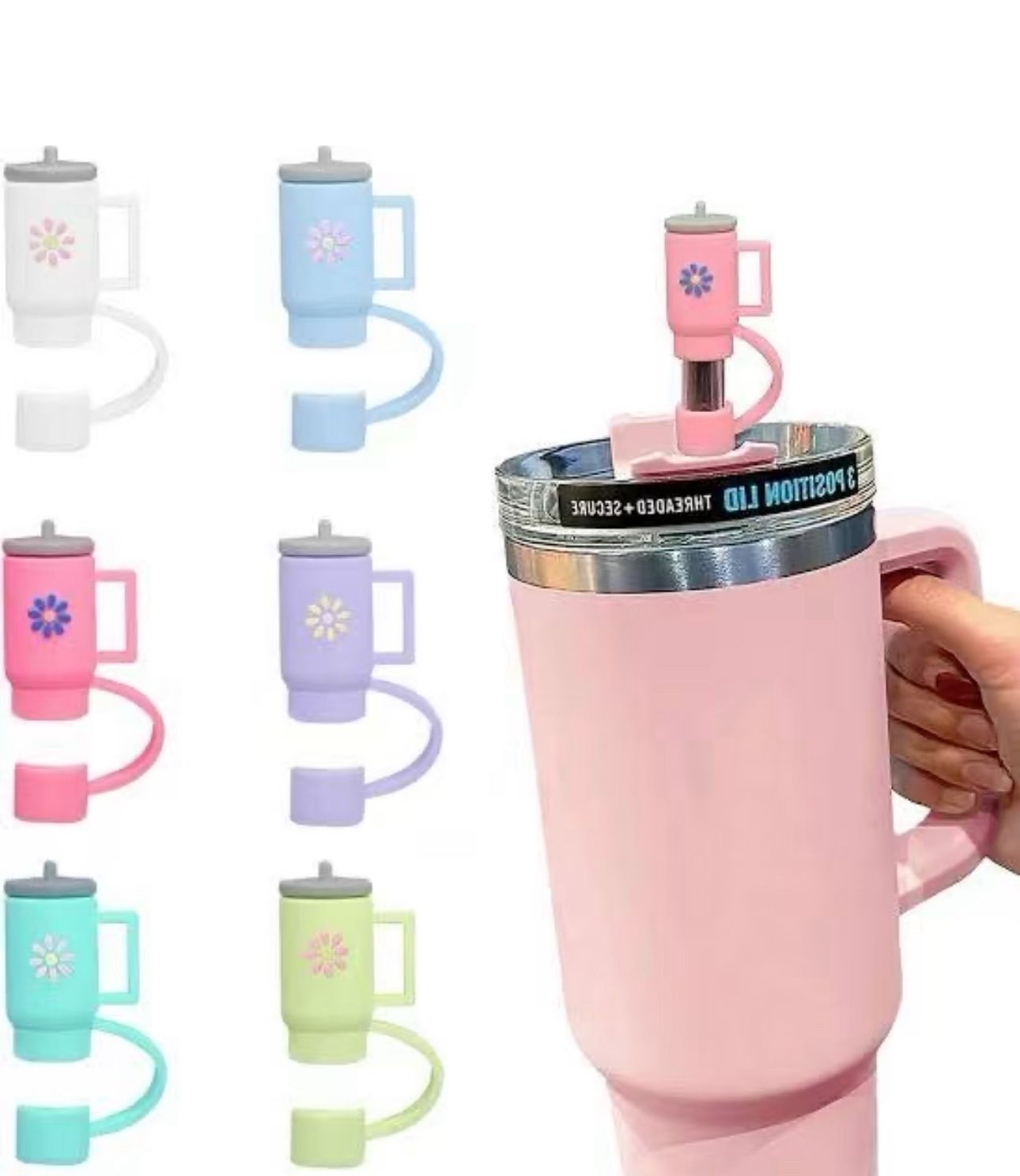 Colorful silicone straw toppers shaped like mini mugs in various pastel colors on a pink travel mug