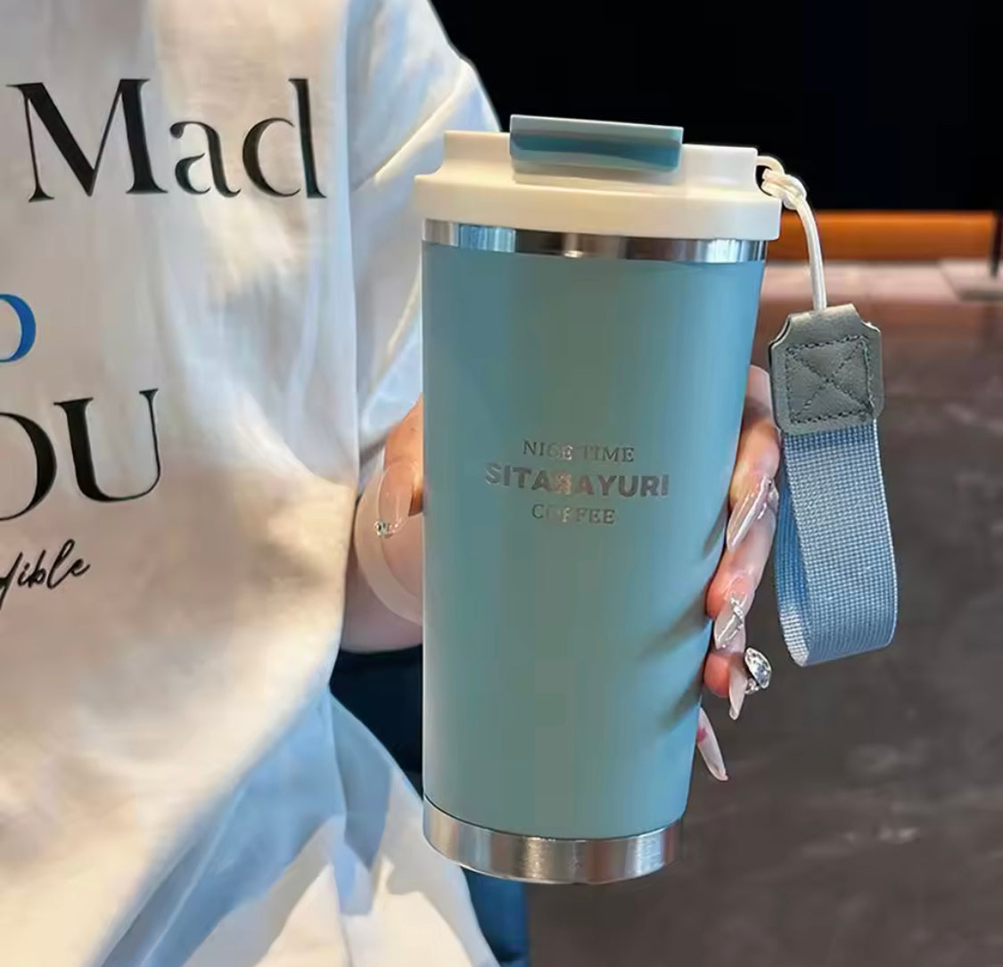 500ml hot and cold water bottle with strap in blue held by person wearing white shirt