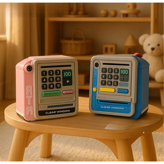 Two smart digital ATM piggy bank models in pink and blue on a wooden table in a cozy room
