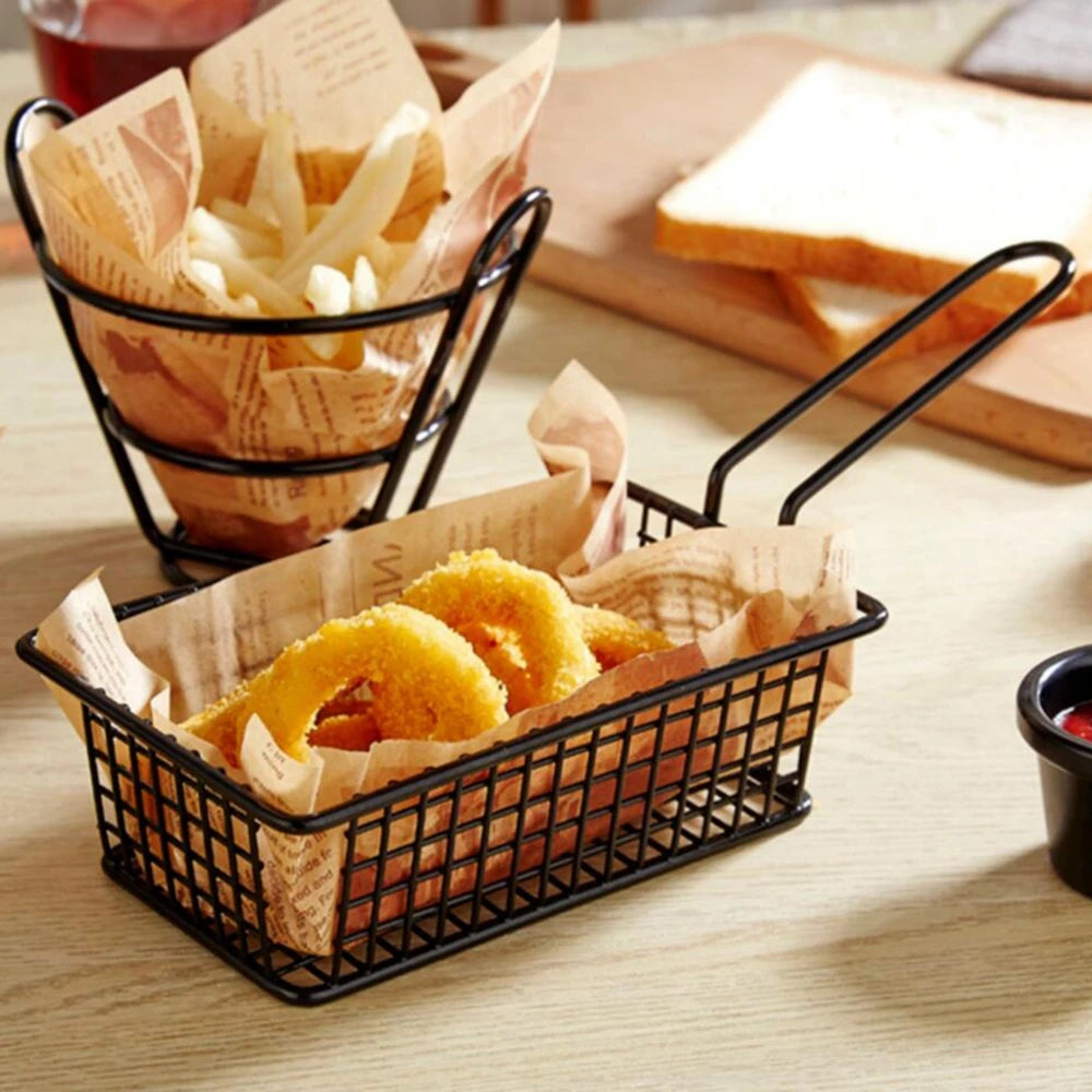 Black metal snack buckets holding fries and onion rings on parchment paper for serving snacks
