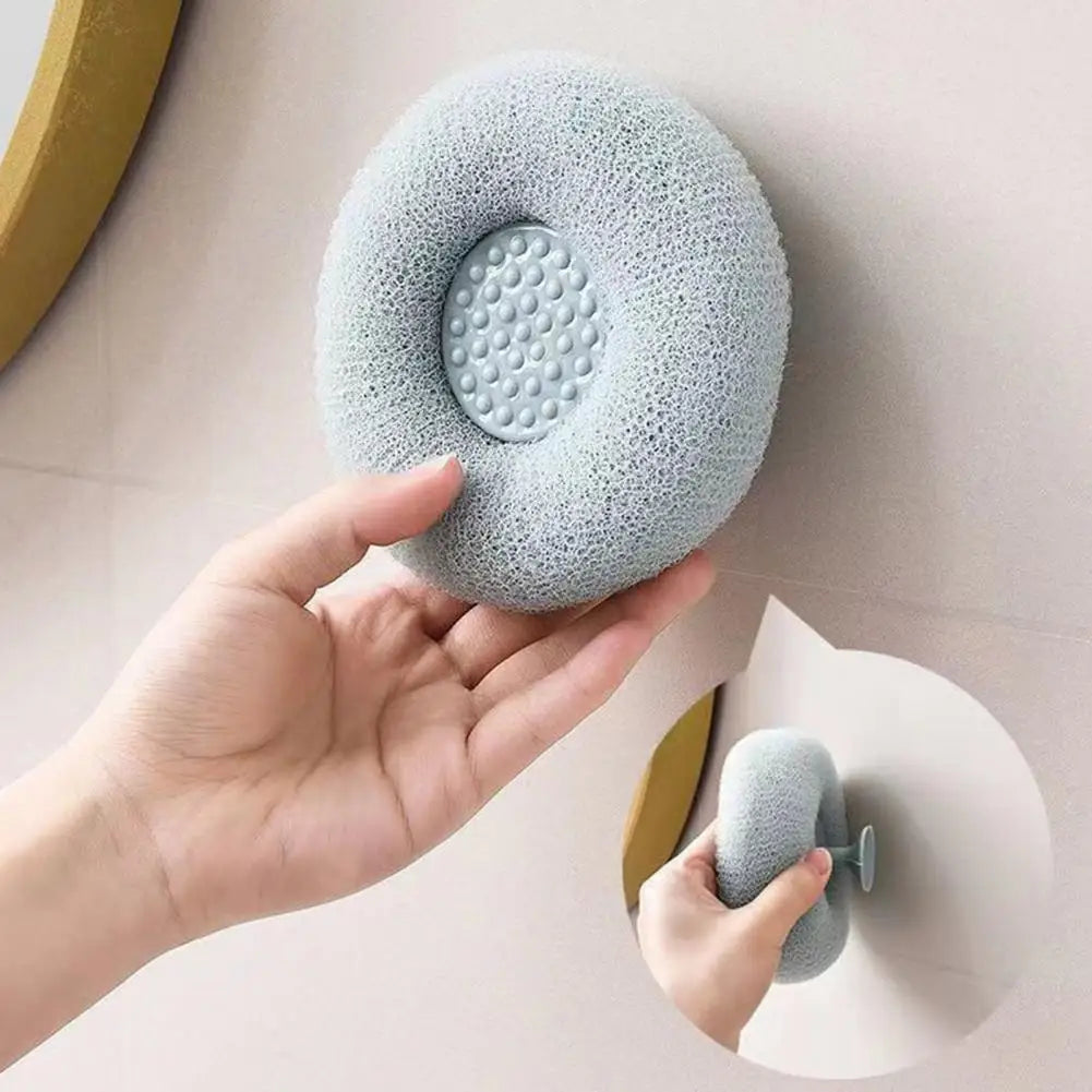 Soft bath brush for exfoliating being held and attached to a wall for easy use