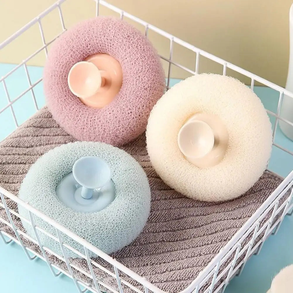 Clarify.pk soft bath brush for exfoliating in pink white and blue colors placed in a white wire basket