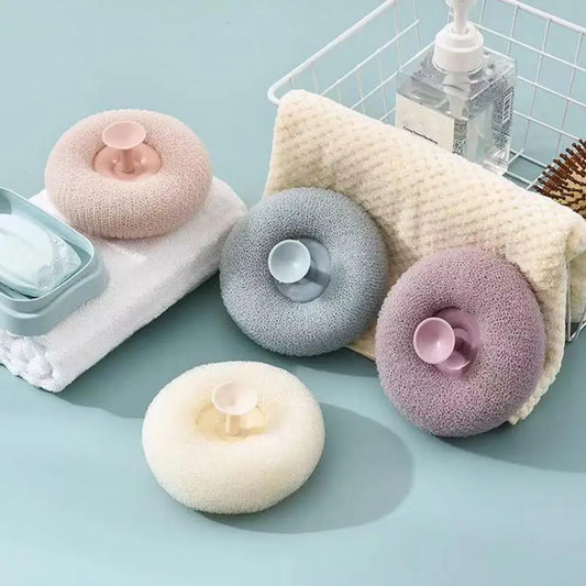 Clarify.pk soft bath brush for exfoliating in pastel colors with round grip design on light blue surface