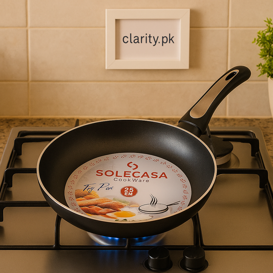 Clarify.pk Solecasa non stick frying pan with ergonomic handle on gas stove burner