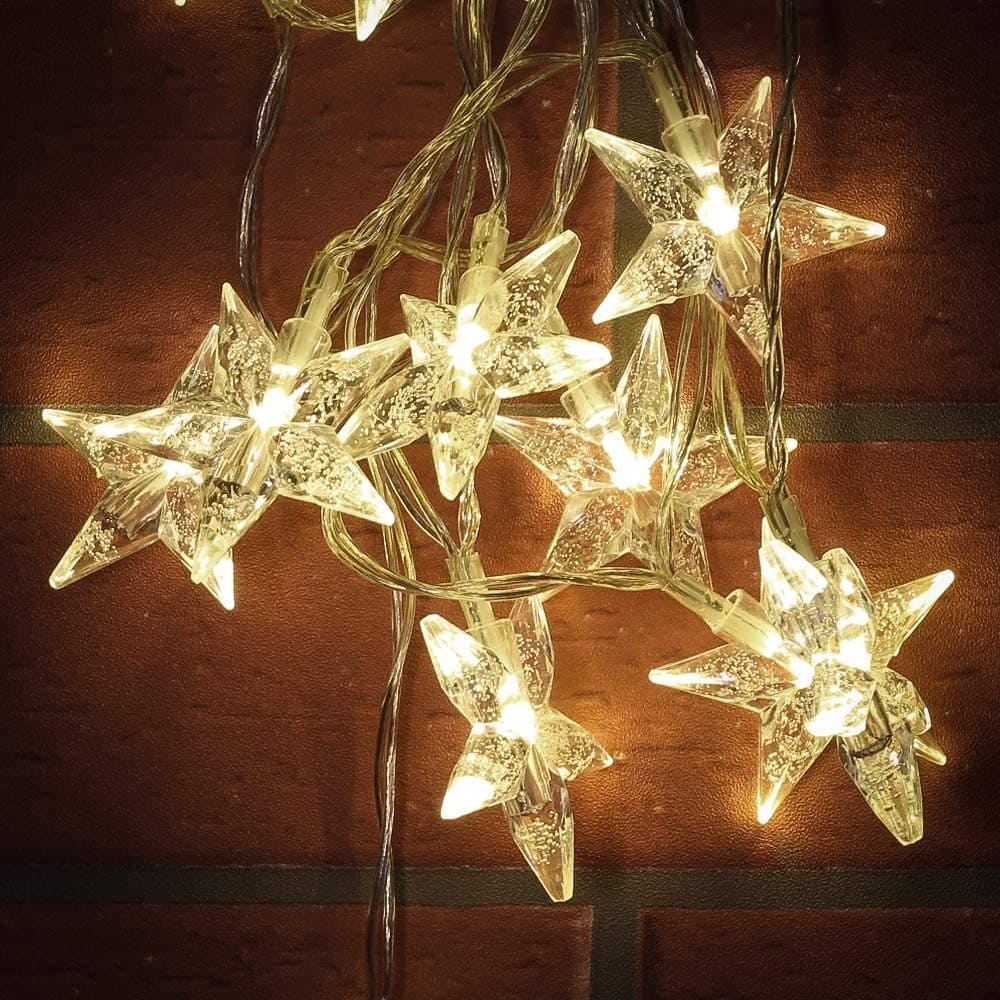 Clarify.pk LED star curtain lights for decoration with warm white glowing star-shaped bulbs