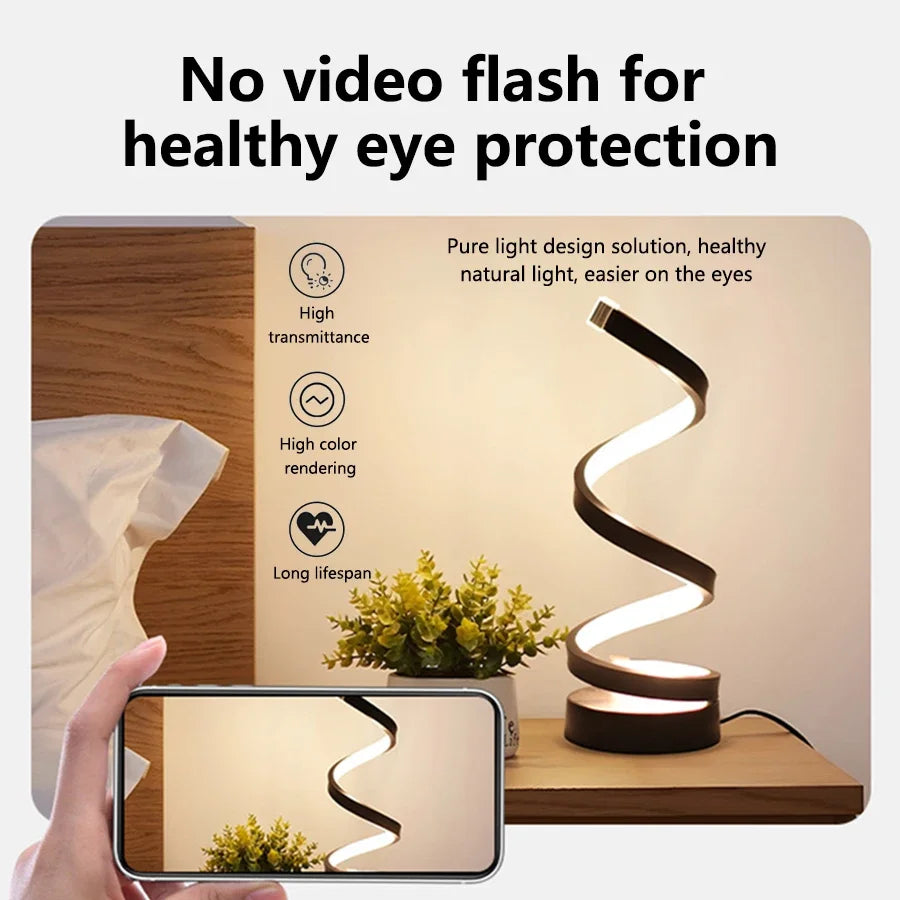 Clarify.pk spiral LED table lamp with no video flash for healthy eye protection on wooden bedside table