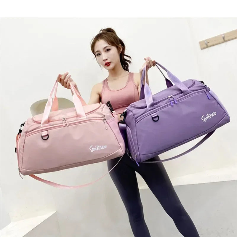 Unisex fitness training bag with shoe compartment in pink and purple colors held by woman wearing pink top