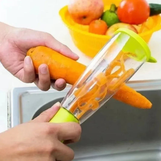 Stainless steel fruit peeler in use peeling a carrot with a transparent container for collecting peels