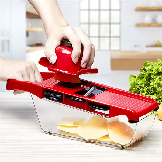 Clarify.pk stainless steel vegetable slicer with red handle and container slicing potatoes in kitchen