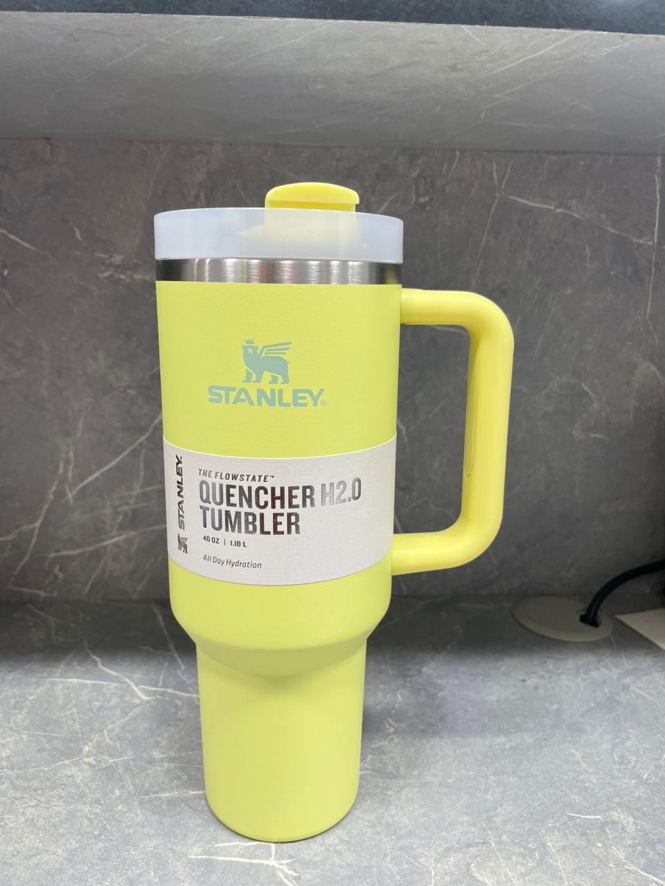 40oz stainless steel tumbler with handle in yellow by Stanley for hot and cold drinks