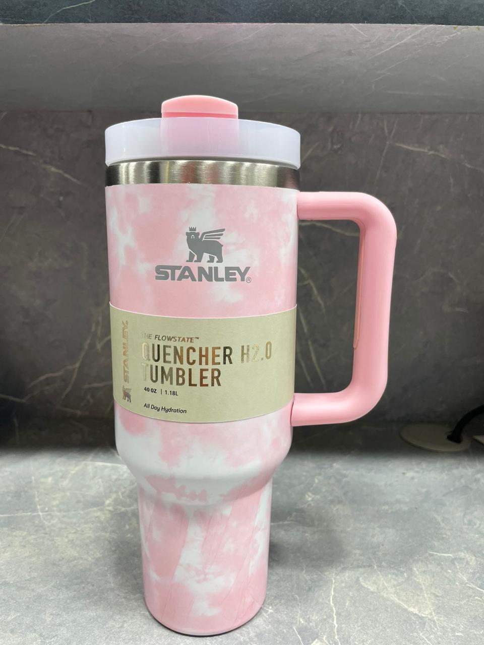 40oz stainless steel tumbler with handle in pink and white tie-dye design by Stanley