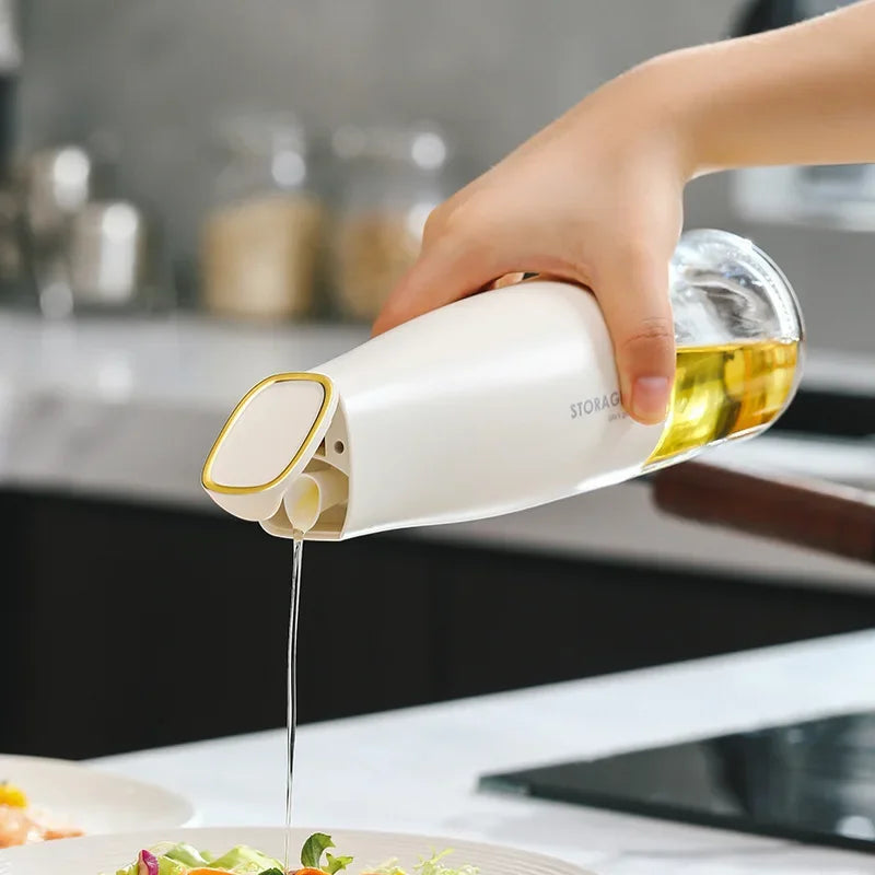 500ml oil bottle for kitchen by Clarify.pk pouring oil over fresh salad in modern kitchen