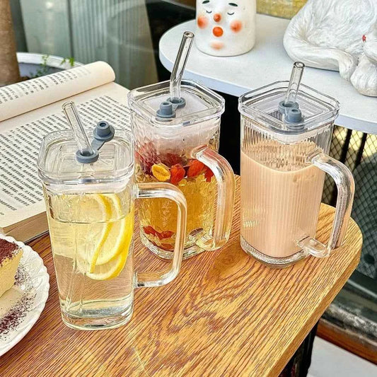 Set of stylish square glass mugs with straws, perfect for beverages and decorations
