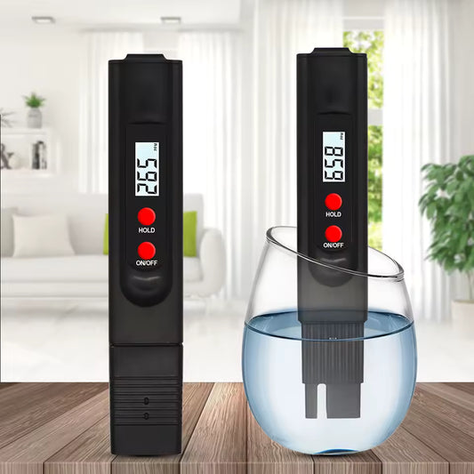 Clarify.pk TDS meter for water testing showing digital readings on a black handheld device in a home setting