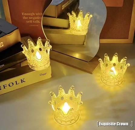 Clarify.pk crown night light decor with warm yellow glow placed on table near books and decorative mirror