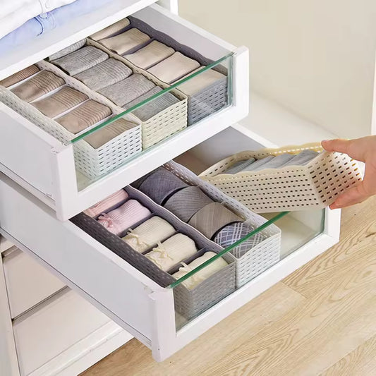 Tidy storage container for clothes organizing socks and undergarments in white drawer with clear panels