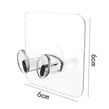 Clear adhesive wall storage hook with dual hooks for hanging items, measuring 6cm by 6cm