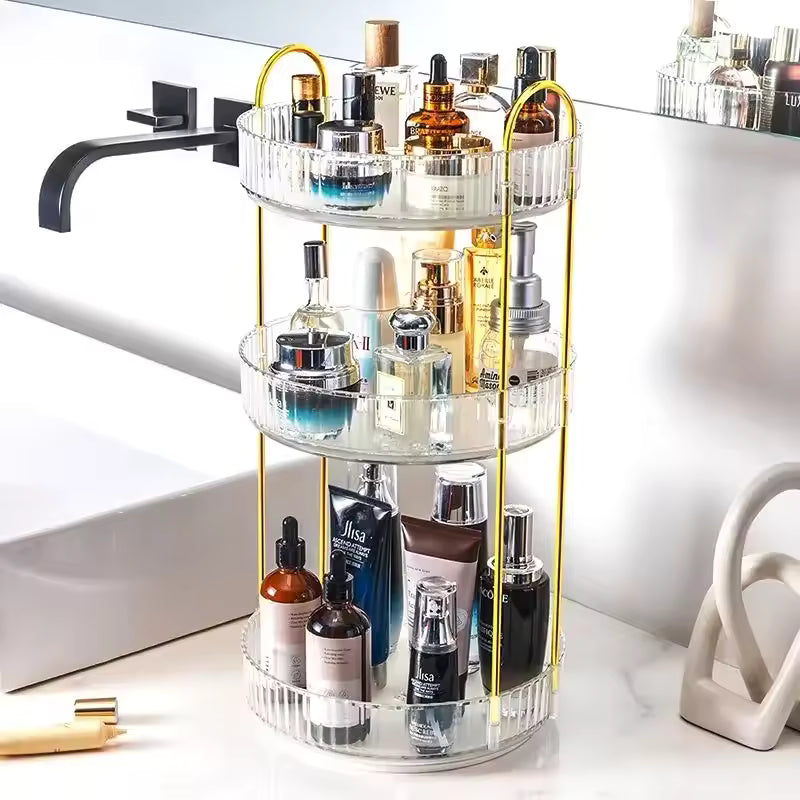 3 tier cosmetics organizer with clear acrylic trays and gold frame holding skincare bottles