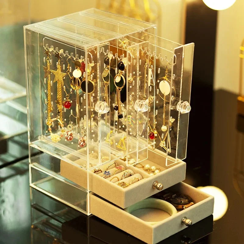Transparent jewelry organizer box by Clarify.pk with multiple compartments for earrings rings and bracelets