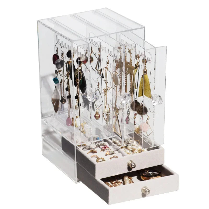 Clear transparent jewelry organizer box with multiple compartments and drawers for earrings and rings