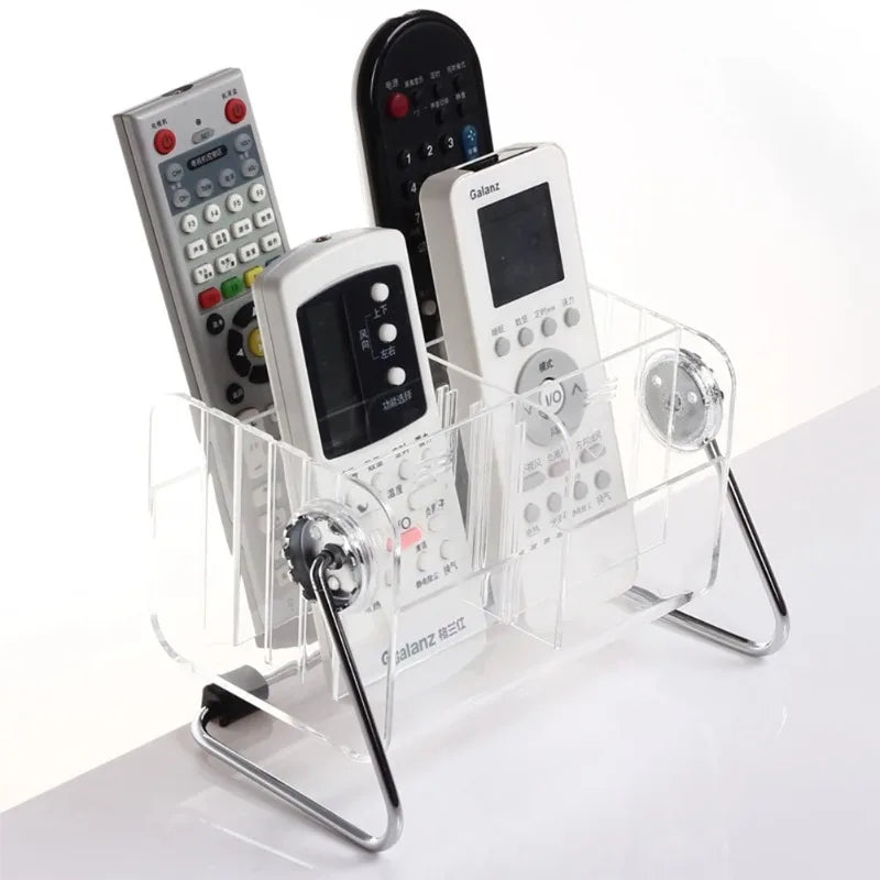 Transparent remote control storage box holding multiple remote controls with metal stand by Clarify.pk