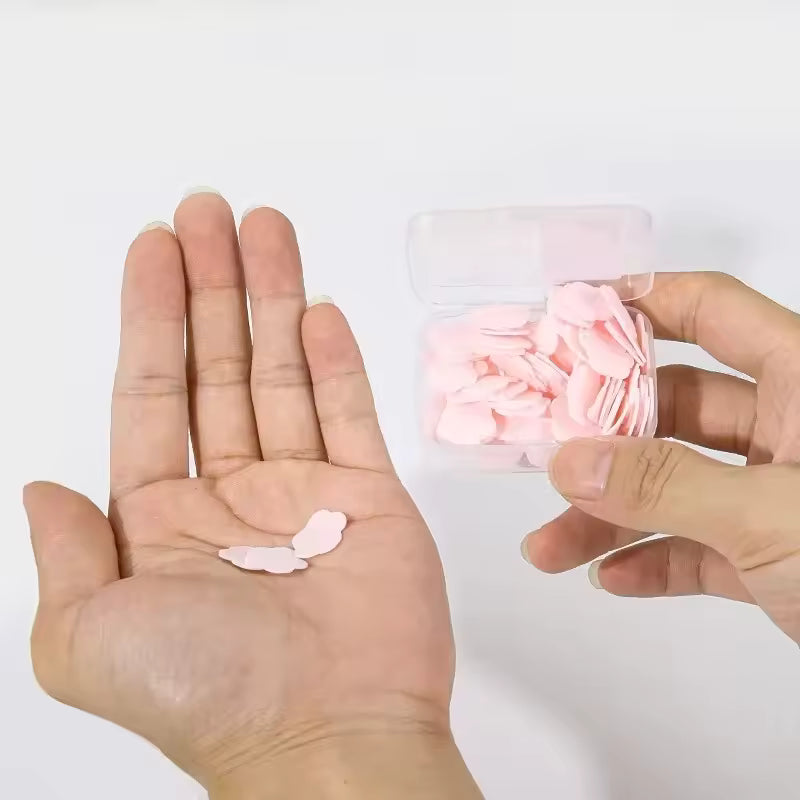 Clarify.pk travel soap paper sheets in a small clear case with pink soap sheets shown on hand