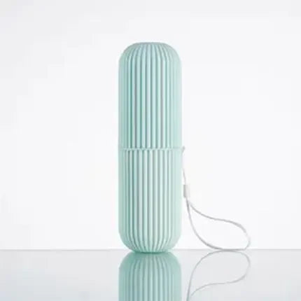 Light blue travel toothpaste storage case with ribbed design and attached carrying strap