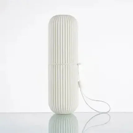 White ribbed travel toothpaste storage case with a secure closure and attached loop for easy carrying