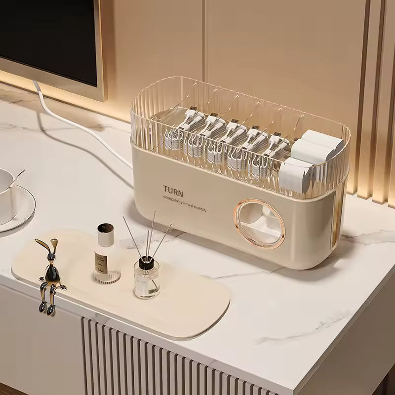 Clarify.pk cable organizer box for desk in beige with multiple cable slots on white desk