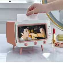Clarify.pk TV tissue box with phone holder in retro design showing a video playing on phone screen