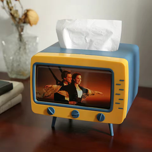 TV tissue box with phone holder in retro design holding tissues on wooden table